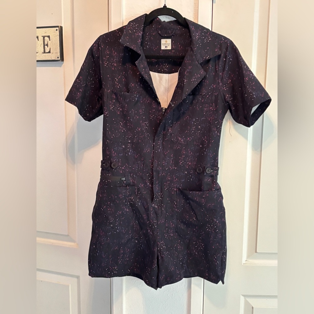 SHREDLY Women’s Trail Romper galaxy splater one piece. Size Small
